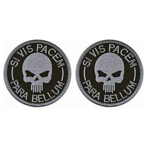 May include: Two black and gray embroidered patches with a skull and crossbones design. The text on the patches reads "Si Vis Pacem Para Bellum".