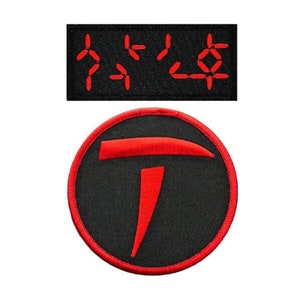 May include: Two embroidered patches, one with a red "T" in a circle and the other with a row of red digital numbers reading "7420".