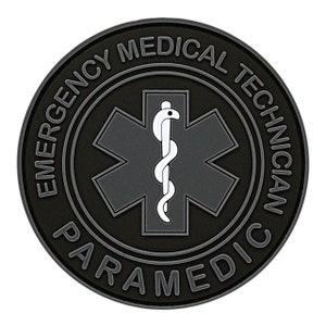 May include: Black and gray round patch with the text "Emergency Medical Technician Paramedic" around the edge. A white star of life with a snake is in the center.