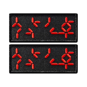 May include: Two black rectangular patches with red embroidered numbers, the top patch reads "11:45" and the bottom patch reads "11:45".