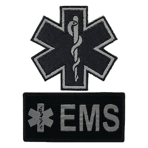 May include: Two black and silver embroidered patches. The first patch is a six-pointed star with a snake and staff in the center. The second patch is rectangular with a six-pointed star and the word "EMS" in silver.