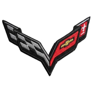 May include: Embroidered patch in a V-shape, featuring a black outline with a red and black design. The patch includes a gold emblem and a white and gray checkered pattern.