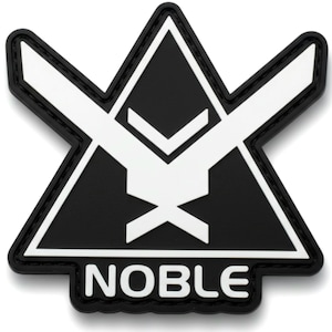 May include: A black and white patch with a geometric design. The patch features a black triangle with a white emblem and the word "NOBLE" at the bottom. The patch has a black border.