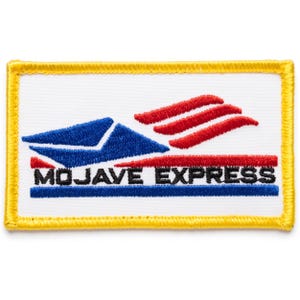 May include: Embroidered patch with a white background, featuring a blue and red design and the words "MOJAVE EXPRESS" in black. The patch has a yellow border.