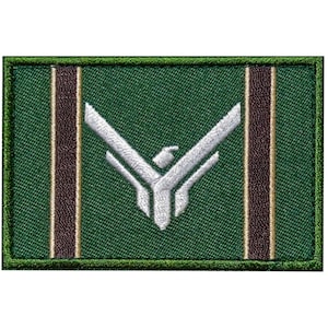 May include: Green embroidered patch with a white stylized bird design and two brown stripes on each side.