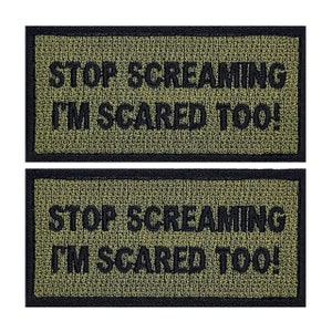 May include: Two green and black embroidered patches with the text "STOP SCREAMING I'M SCARED TOO!"