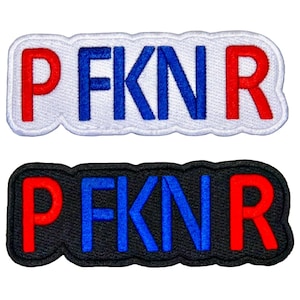 May include: Two embroidered patches with the letters "PFKNR". One patch has white fabric with red and blue letters, and the other has black fabric with red and blue letters. The patches have a stitched border.