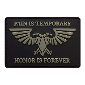 May include: Black patch with a silver eagle and the text "PAIN IS TEMPORARY HONOR IS FOREVER".