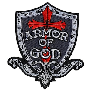 May include: A gray and silver embroidered patch with a red cross and the words "Armor of God".