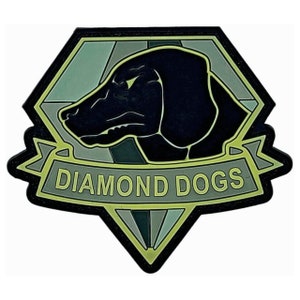 May include: A black and green patch with a diamond shape and a black dog's head inside. The text "DIAMOND DOGS" is written in yellow on a banner below the diamond.