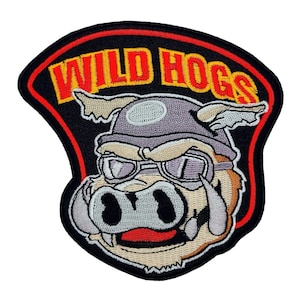 May include: Embroidered patch with a cartoon pig wearing goggles and a helmet. The patch is black with a red border and the words "WILD HOGS" in yellow lettering.