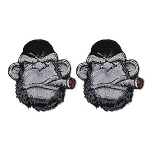 May include: Two black and white embroidered iron-on patches of a monkey face with a cigar in its mouth.