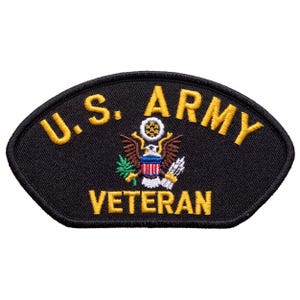 May include: A black embroidered patch with a curved top edge. The text U.S. ARMY is stitched in yellow at the top, and VETERAN is stitched in yellow at the bottom. In the center is a detailed eagle emblem with a shield, olive branch, and arrows.