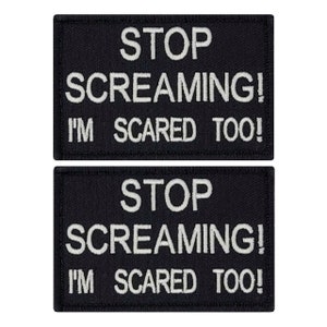 May include: Two black embroidered patches with white text. The text on both patches reads "STOP SCREAMING! I'M SCARED TOO!"