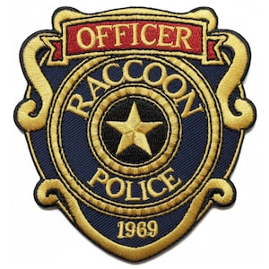 May include: Embroidered patch featuring a police badge design. The patch has a navy blue background with gold and red accents. The text "OFFICER", "RACCOON POLICE", and "1969" are visible.