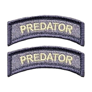 May include: Two gray fabric patches with white embroidered text that reads "PREDATOR".