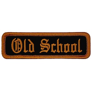 May include: Black and orange embroidered patch with the text "Old School" in a gothic font.