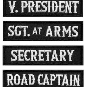 May include: Six black embroidered patches with white text. The patches read: "PRESIDENT", "V. PRESIDENT", "SGT. AT ARMS", "SECRETARY", "ROAD CAPTAIN", and "CHAPLAIN".