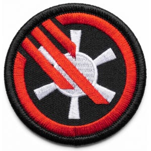 May include: A round, embroidered patch with a black background. A red circle surrounds a white, six-pointed star design. Three red diagonal stripes cross the center, with a white stripe in between. The patch has a black border.