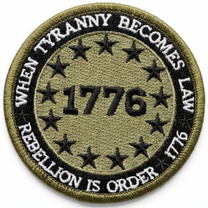 May include: Round olive green patch with black text and accents. The patch features the year "1776" in the center, surrounded by black stars. The outer ring reads "WHEN TYRANNY BECOMES LAW REBELLION IS ORDER 1776".