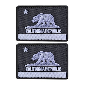 May include: Two black embroidered patches with a white star, a white bear, and the text "CALIFORNIA REPUBLIC" in white. The patches are rectangular and have a white border.