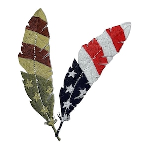 May include: Two embroidered feathers, one with red, white, and blue stripes and the other with brown, green, and gold stripes. Both feathers have white stars.