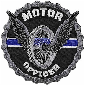 May include: Black and gray embroidered patch with a motorcycle wheel, wings, and the text "MOTOR OFFICER" in a circle. A blue and white thin blue line is above the wheel.