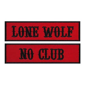 May include: Two red embroidered patches with black stitching. The top patch reads "LONE WOLF" and the bottom patch reads "NO CLUB".