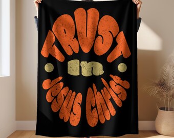 Manta de terciopelo ligera e inspiradora con la frase motivacional «Confía en Jesús».