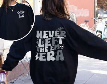 May include: Black sweatshirt with a graphic print on the back that says "Never Left The Emo Era" and a smaller graphic print on the front that says "Elder Emo".