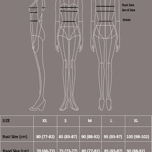 May include: A size chart for clothing with measurements in inches and centimeters. The chart shows bust, band, and waist sizes for XS, S, M, L, and XL.