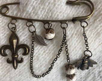 Vintage brass look Sweater Pin-Jacket Pin-Kilt Pin with Fleur de Lis charm, leaf, bumble bee and ivory beads