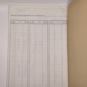 May include: A blank white page with a gridded table for tracking orders. The table has columns for date, reference number, and amount of the order. The text "Recapitulatif des commandes que j'ai effectuees a..." is at the top of the page.