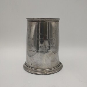 May include: A silver metal cup with an inscription that reads: "PRESENTED TO OFFICERS RAF HILAVINGTON BY S/LDR I B BUTLER DFC AFC JULY 1945 FEBRUARY 1948"