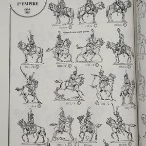 May include: Black and white line drawings of historical military figures on horseback. The figures are wearing uniforms and hats. The drawings are labeled with numbers and descriptions. The title of the page is "C.B.G. 1er EMPIRE 1804 1815" and "Guides ou Hussards de la garde de Murat, Roi de Naples (1812)".