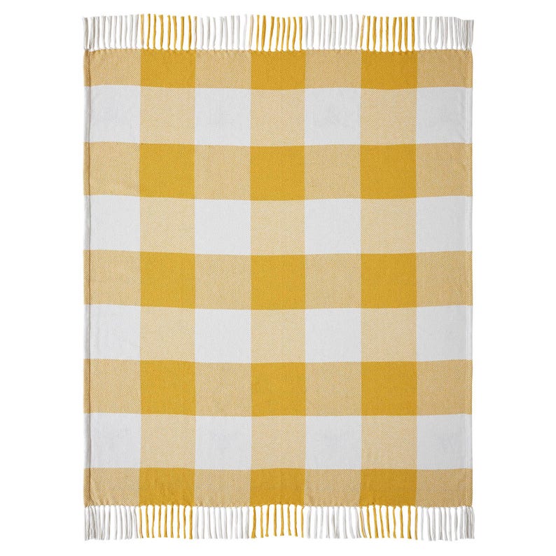 May include: A rectangular throw blanket featuring a large-scale yellow and white gingham check pattern. The blanket is finished with a fringe trim along the top and bottom edges, consisting of alternating yellow and white vertical yarn strands.