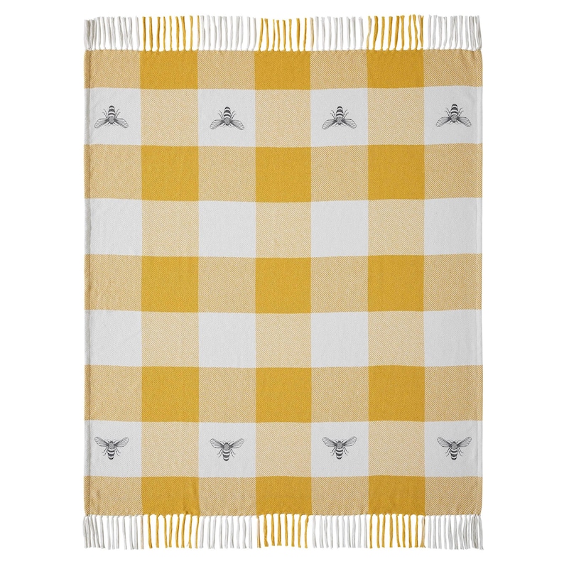 May include: A woven throw blanket featuring a yellow and white buffalo check pattern. The blanket is decorated with small, repeating grey bee illustrations centered within the white squares. It is finished with white fringe along the top and bottom.