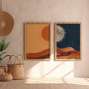May include: Two framed abstract art prints. One features a sun design in orange and yellow hues, the other a moon in a dark blue and orange landscape. A woven hat hangs above a potted plant and woven baskets.