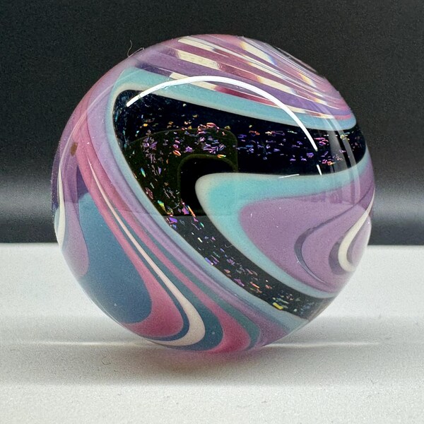 1.33 inch HOT Pink Marble with multi colored dichroic.
