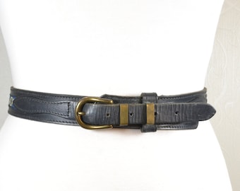 Black western leather belt with bronze buckle