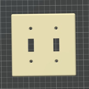 Puede incluir: Una placa de interruptor de luz doble de plástico blanco con dos interruptores de palanca.