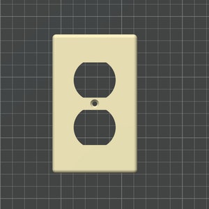 以下が含まれることがあります： クリーム色の電気コンセントカバーで、プラグ用の丸い穴が2つあります。