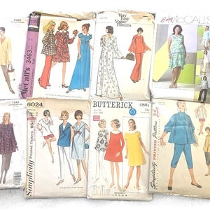 May include: A collection of vintage sewing patterns for women's clothing. The patterns are from different brands, including Vogue, McCall's, Simplicity, and Butterick. The patterns feature a variety of styles, including dresses, skirts, tops, and trousers. The patterns are all in various colours, including pink, blue, green, and yellow.