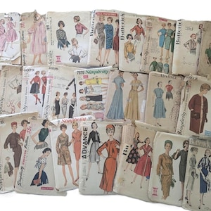 May include: A collection of vintage sewing patterns for clothing, featuring various designs and styles. The patterns are from brands like Simplicity, Butterick, and Advance. Some patterns include illustrations of dresses, skirts, and tops.
