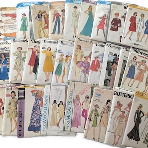 May include: A collection of vintage sewing patterns for clothing, featuring a variety of styles and designs. The patterns are from different brands, including Simplicity, McCall's, and Butterick. The patterns are in various colors, including red, blue, green, yellow, and white.