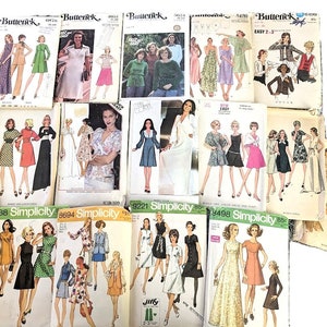 May include: A collection of vintage sewing patterns for women's clothing. The patterns are from the brands Butterick and Simplicity and feature a variety of styles, including dresses, skirts, and tops. The patterns are in various colors, including green, red, blue, and white.
