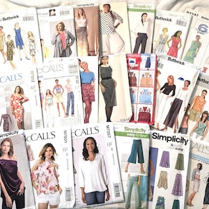 May include: A collection of vintage sewing patterns from brands like Butterick, Simplicity, and McCall's. The patterns feature illustrations of dresses, tops, skirts, and pants. The patterns are in various sizes and styles, with text such as "easy-to-sew".