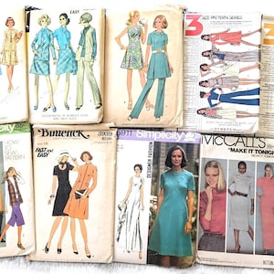 May include: A collection of vintage sewing patterns for women's clothing. The patterns feature a variety of styles, including dresses, pantsuits, and skirts. The patterns are from the 1970s and are in excellent condition.