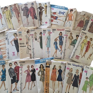 May include: A collection of vintage sewing patterns for dresses, skirts, and tops. The patterns are from Simplicity, McCall's, and Butterick. The patterns are in various colors, including pink, blue, green, and yellow. The patterns are in various sizes, including 6, 8, 10, 12, 14, 16, 18, and 20.