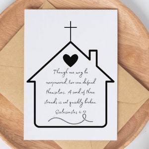 May include: A white card with a black house outline, a cross, and a heart. The card features the text "Though one may be overpowered, two can defend themselves. A cord of three strands is not quickly broken. Ecclesiastes 4:12."